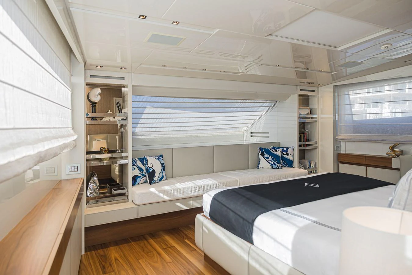 A luxurious stateroom featuring a large bed, elegant decor, and ample natural light. aboard PERCAL Yacht for Sale