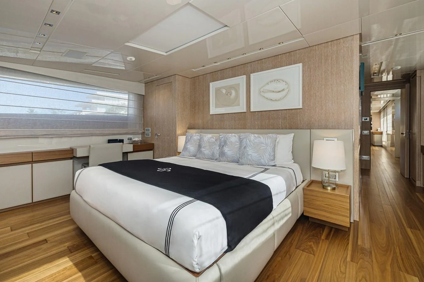 The master stateroom features a luxurious bed with elegant decor and ample natural light. aboard PERCAL Yacht for Sale