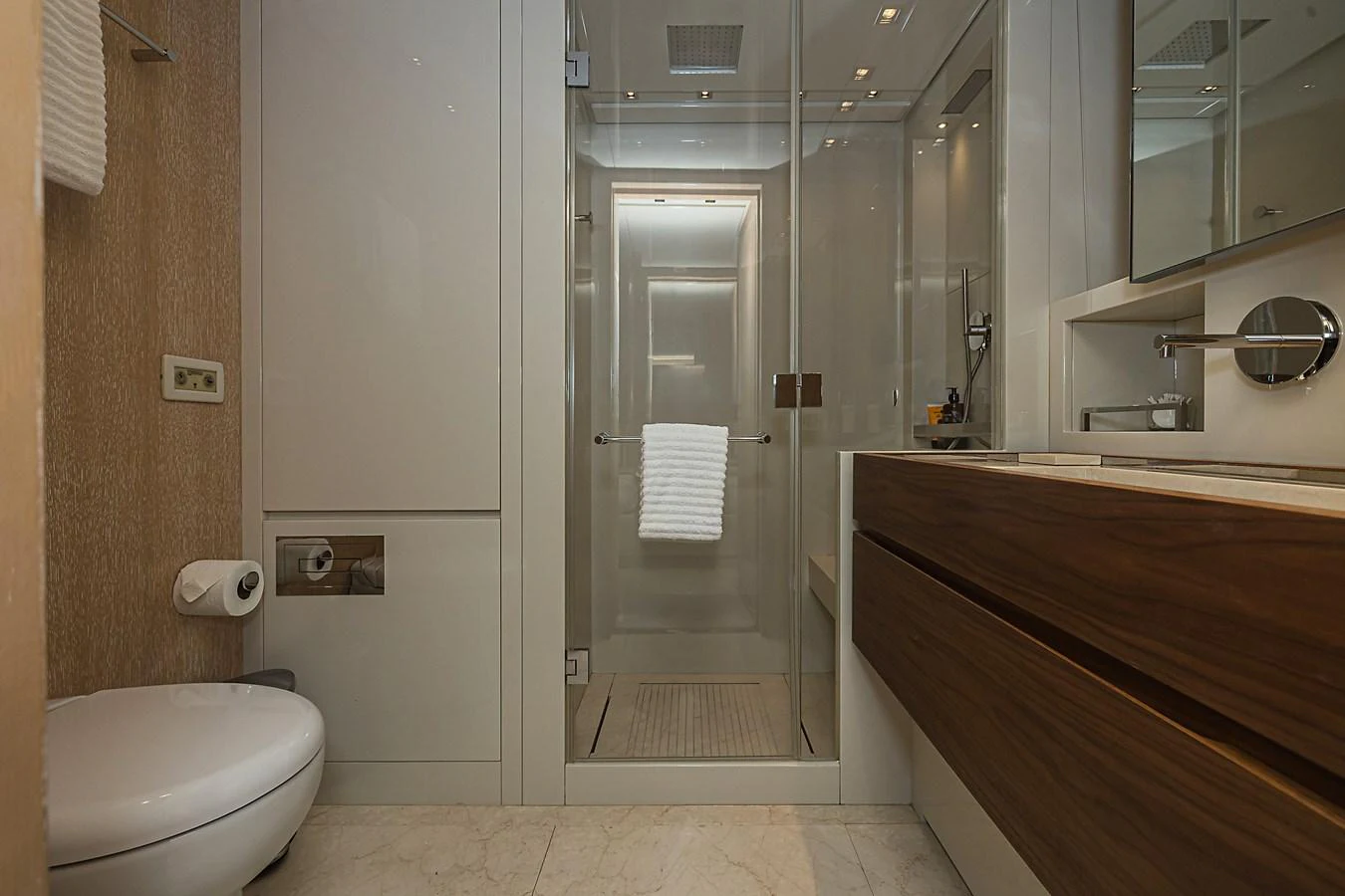 A modern yacht bathroom featuring a glass-enclosed shower, sleek vanity, and contemporary fixtures. aboard PERCAL Yacht for Sale