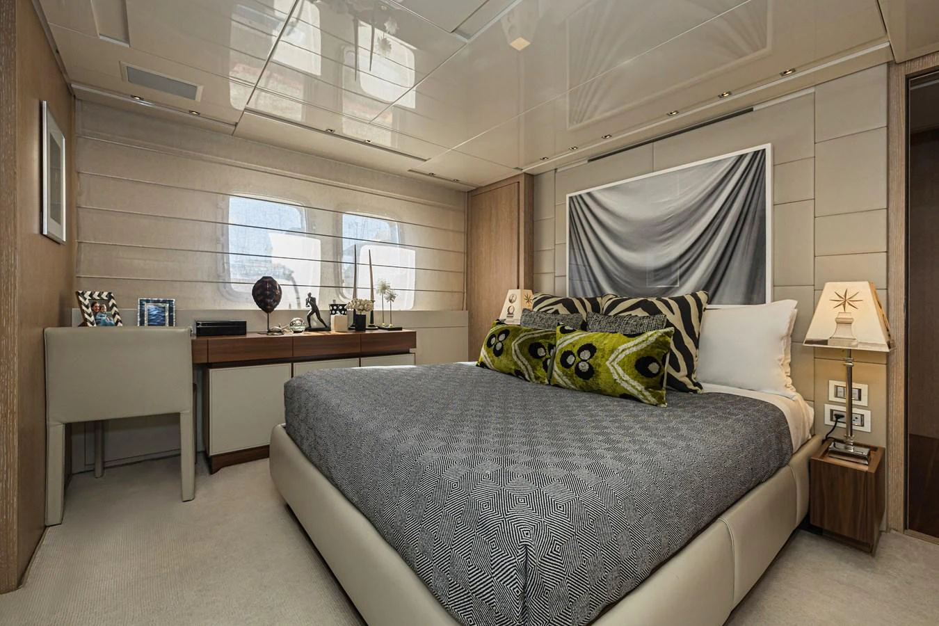 A luxurious stateroom featuring a comfortable bed, stylish decor, and ample natural light. aboard PERCAL Yacht for Sale
