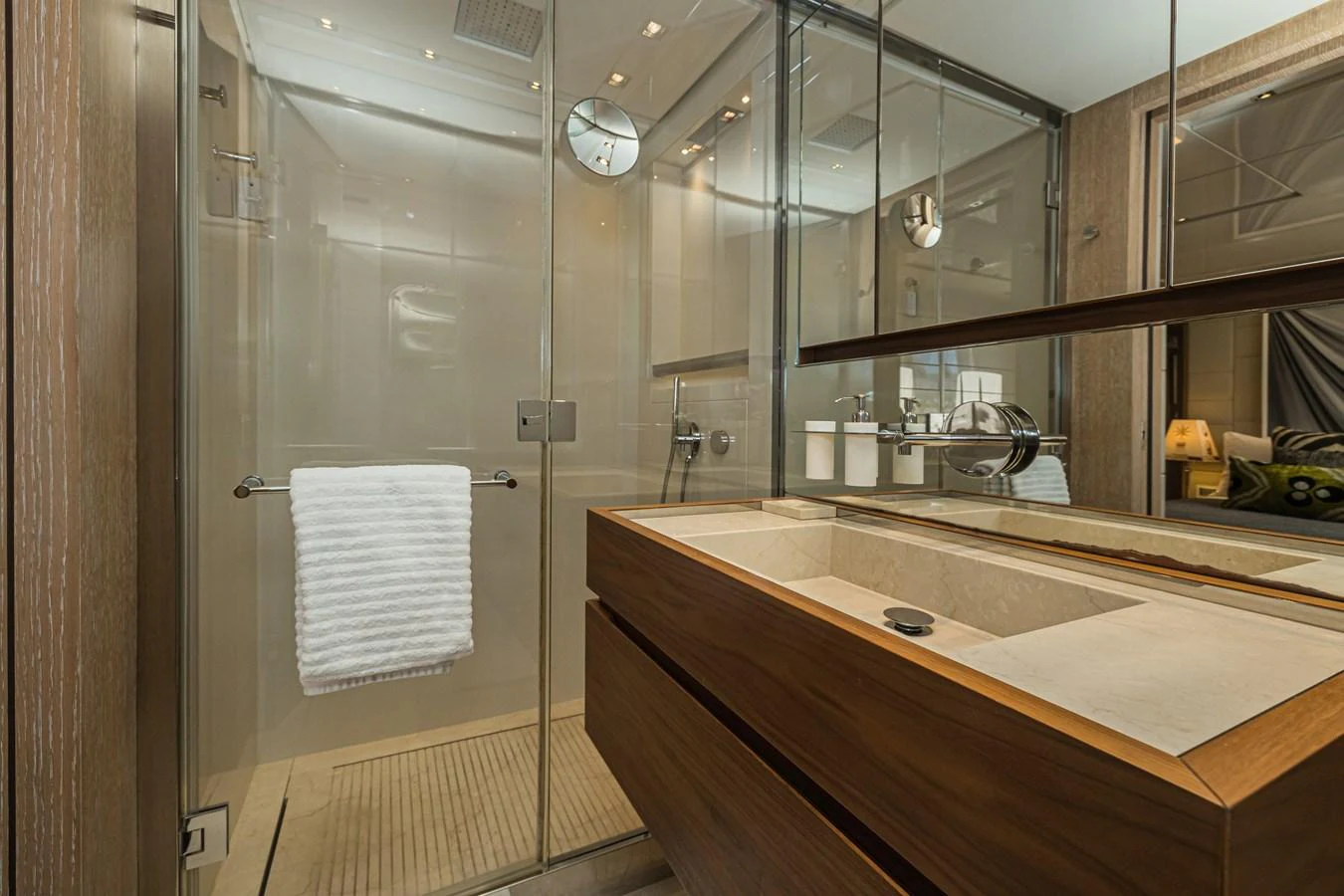 The yacht's bathroom features a sleek, modern design with a spacious shower and elegant fixtures. aboard PERCAL Yacht for Sale