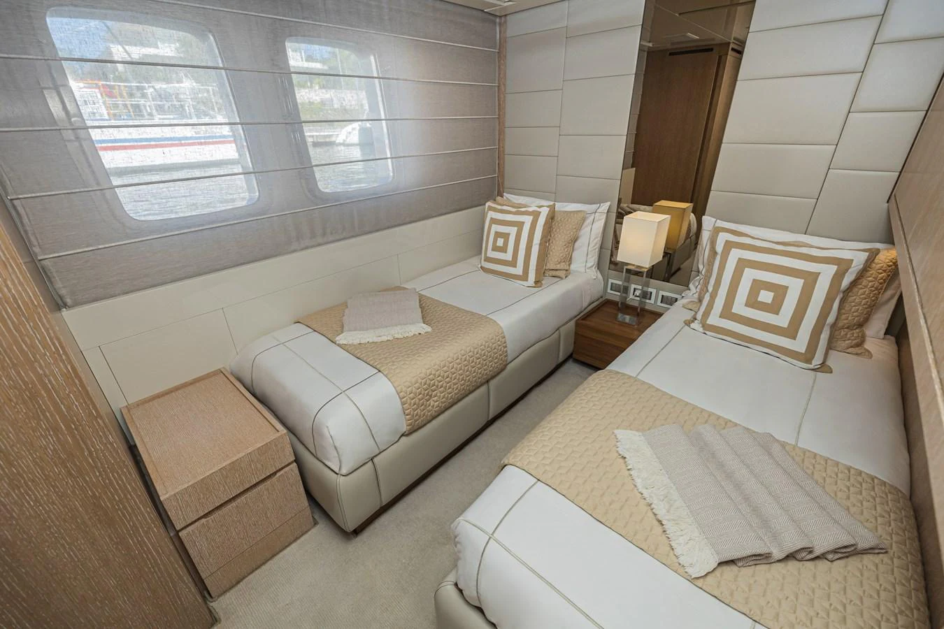 The guest stateroom features twin beds with elegant bedding and ample natural light from the windows. aboard PERCAL Yacht for Sale