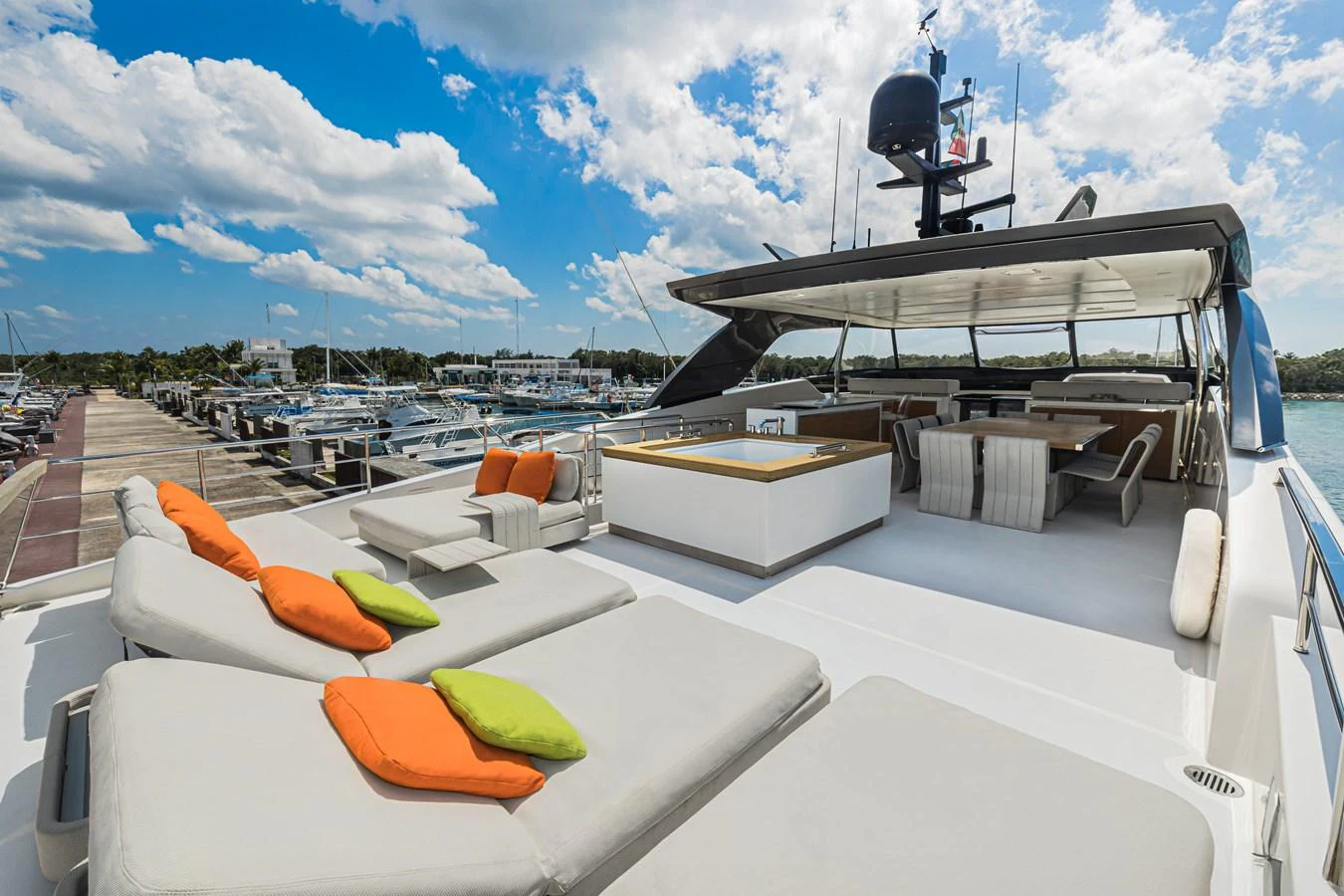 The sundeck offers luxurious lounging with plush sunbeds and vibrant cushions, perfect for relaxation under the open sky. aboard PERCAL Yacht for Sale
