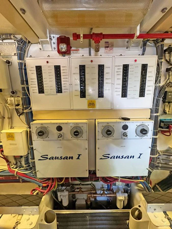 The image showcases the yacht's electrical control panels and systems, highlighting its technical sophistication. aboard HATTERAS 68 CONVERTIBLE Yacht for Sale