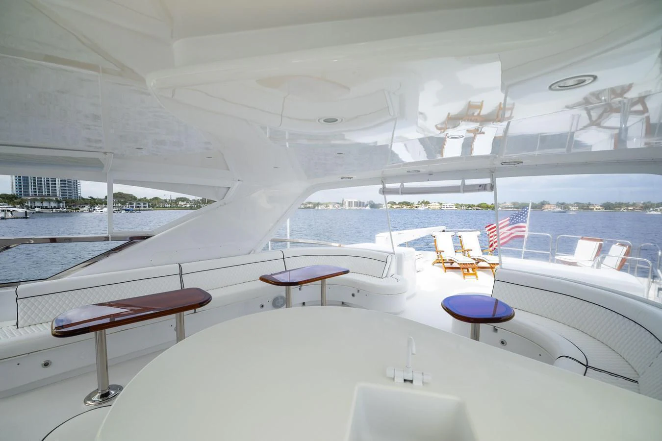The sundeck offers a spacious and relaxing area with stunning views of the water. aboard OUTRAGEOUS Yacht for Sale