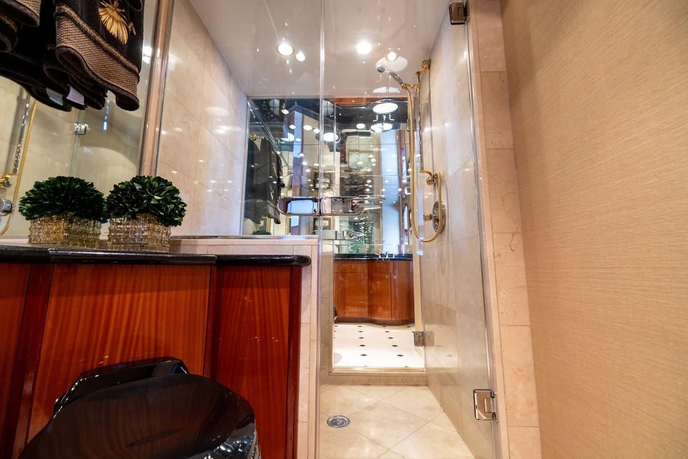 The yacht's bathroom features luxurious fixtures and elegant decor. aboard OUTRAGEOUS Yacht for Sale