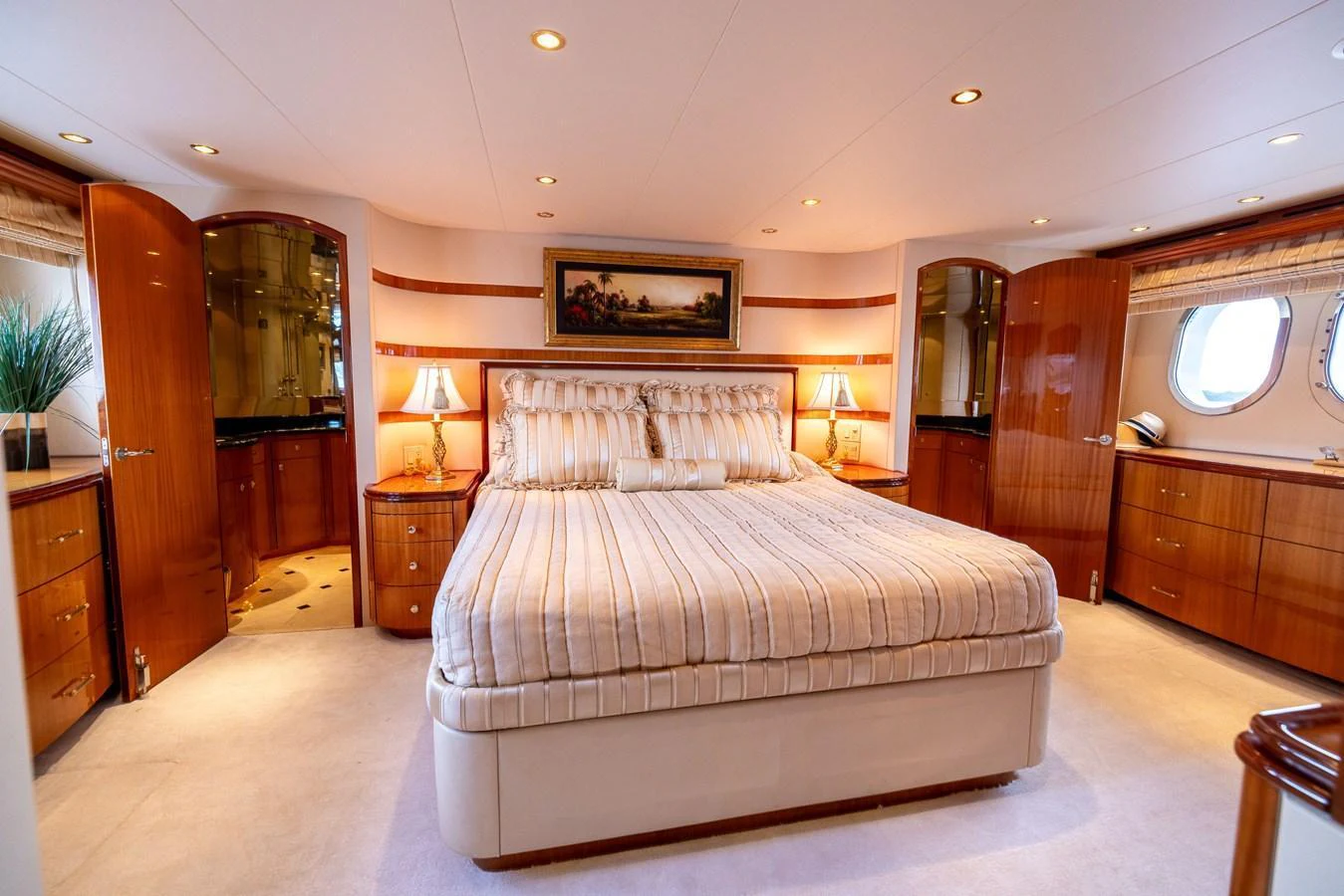 The master stateroom exudes luxury with its spacious layout and elegant furnishings. aboard OUTRAGEOUS Yacht for Sale