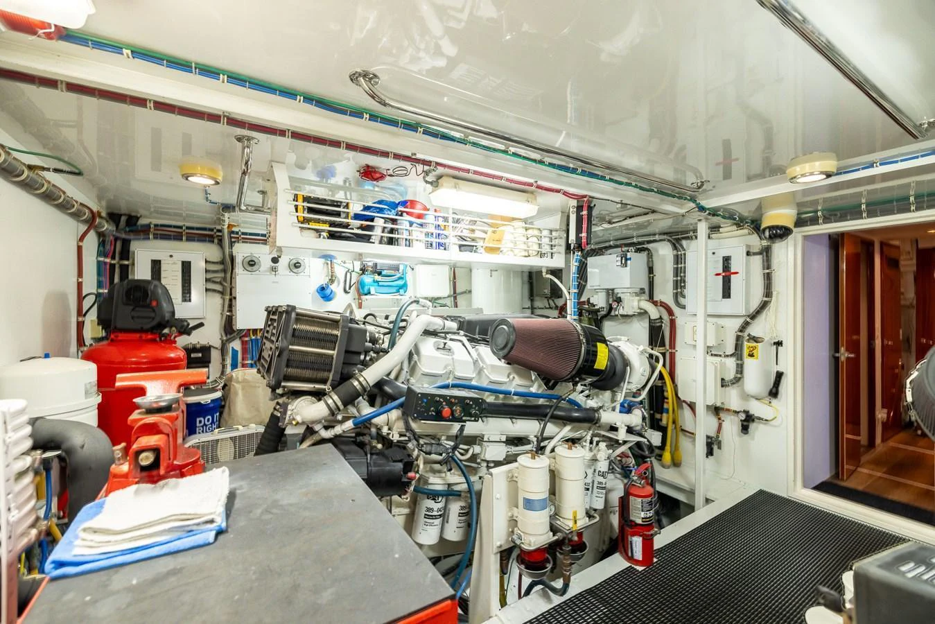 The engine room showcases a well-organized and meticulously maintained space with advanced machinery and equipment. aboard OUTRAGEOUS Yacht for Sale