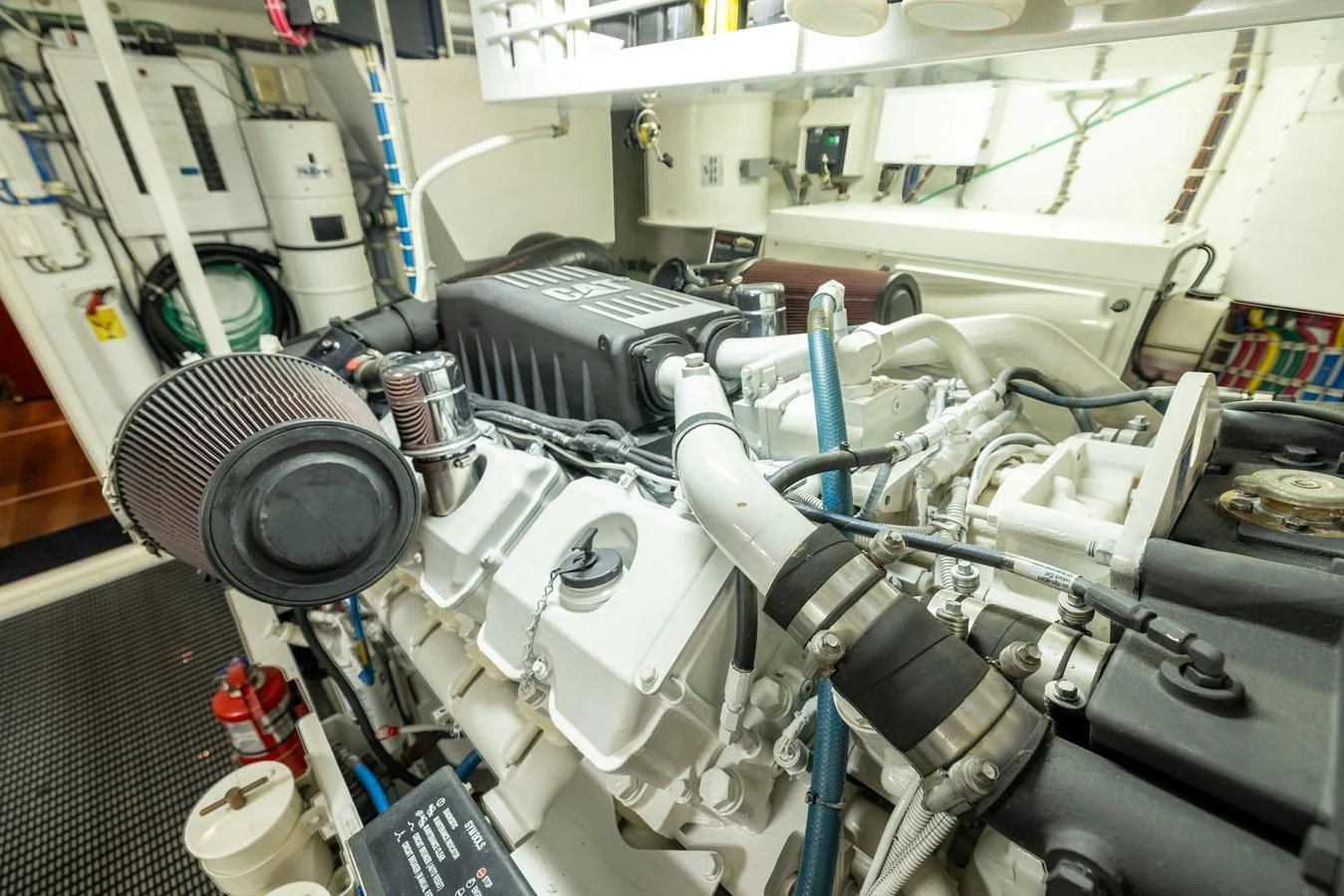 The image showcases the yacht's well-maintained engine room with high-quality machinery. aboard OUTRAGEOUS Yacht for Sale