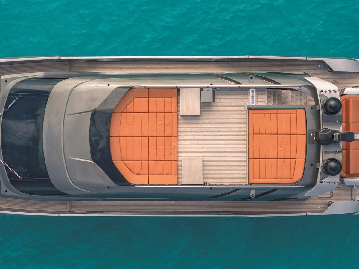 The yacht's sundeck features plush orange sunbeds and a sleek, modern design, perfect for relaxation on the water. aboard AB 80 Yacht for Sale