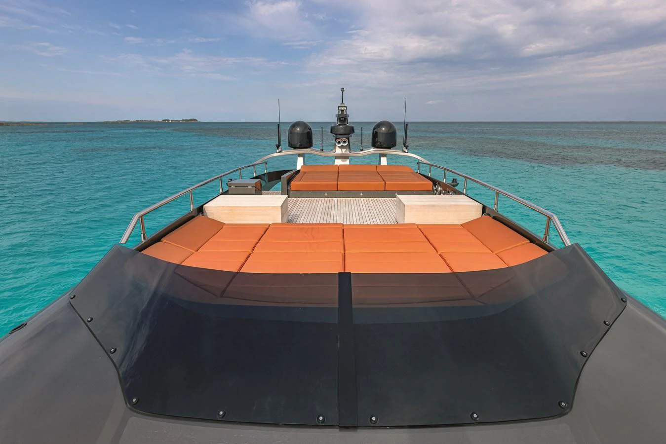 The yacht's foredeck features spacious sun pads with a stunning view of the turquoise sea. aboard AB 80 Yacht for Sale
