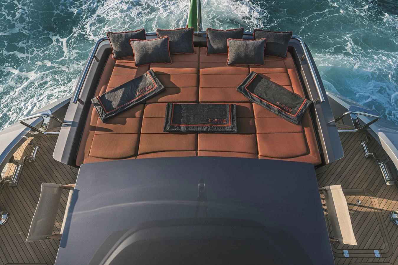 The sundeck features a spacious sunbathing area with luxurious cushions and a stunning view of the ocean. aboard AB 80 Yacht for Sale