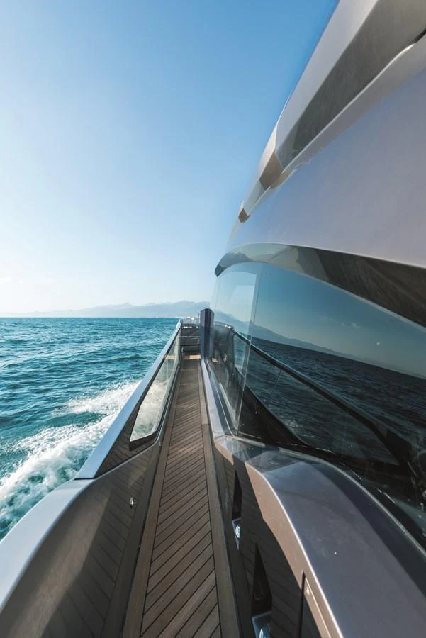 A sleek yacht glides through the water, showcasing its modern design and expansive windows. aboard AB 80 Yacht for Sale