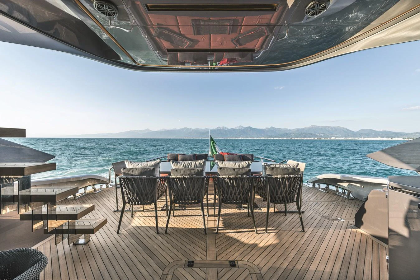 The aft deck offers a stunning dining area with panoramic ocean views. aboard AB 80 Yacht for Sale