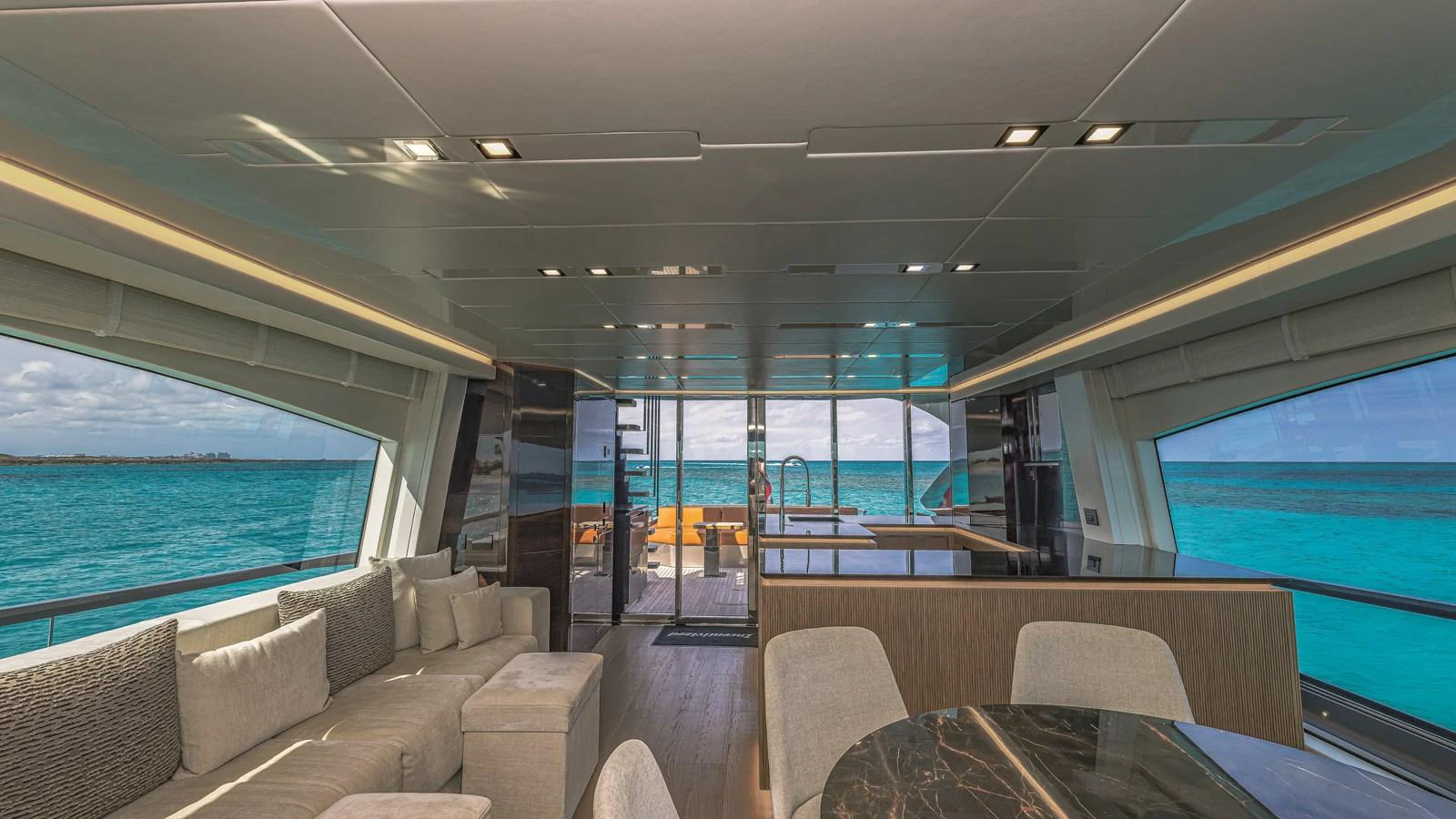 The spacious salon offers panoramic views and luxurious seating arrangements. aboard AB 80 Yacht for Sale