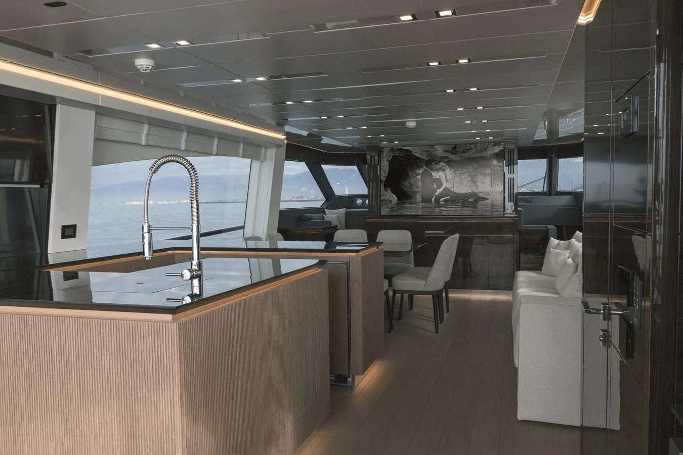 The salon features modern furnishings and expansive windows offering panoramic views. aboard AB 80 Yacht for Sale
