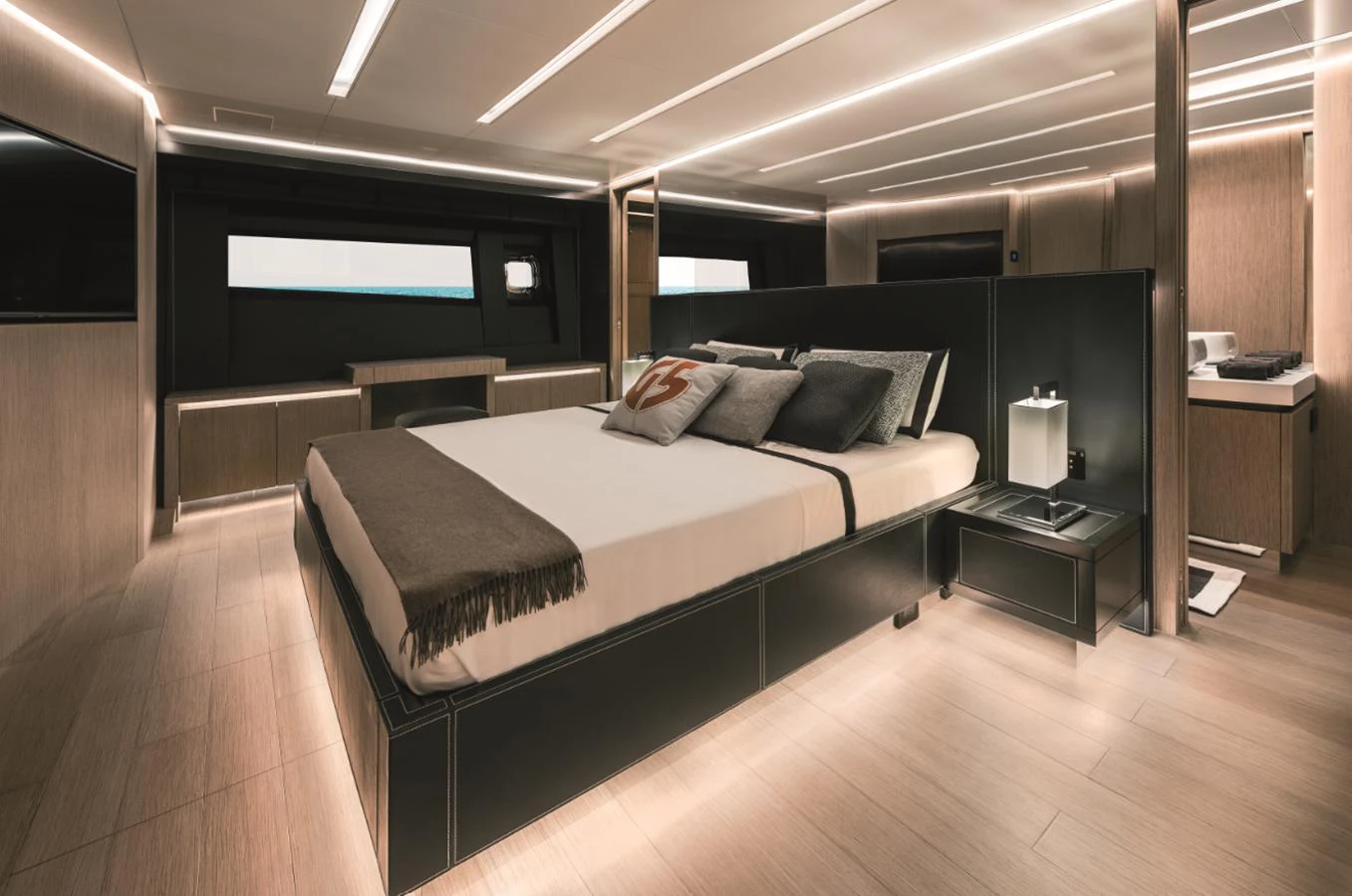 The master stateroom features a luxurious bed with modern lighting and elegant decor. aboard AB 80 Yacht for Sale