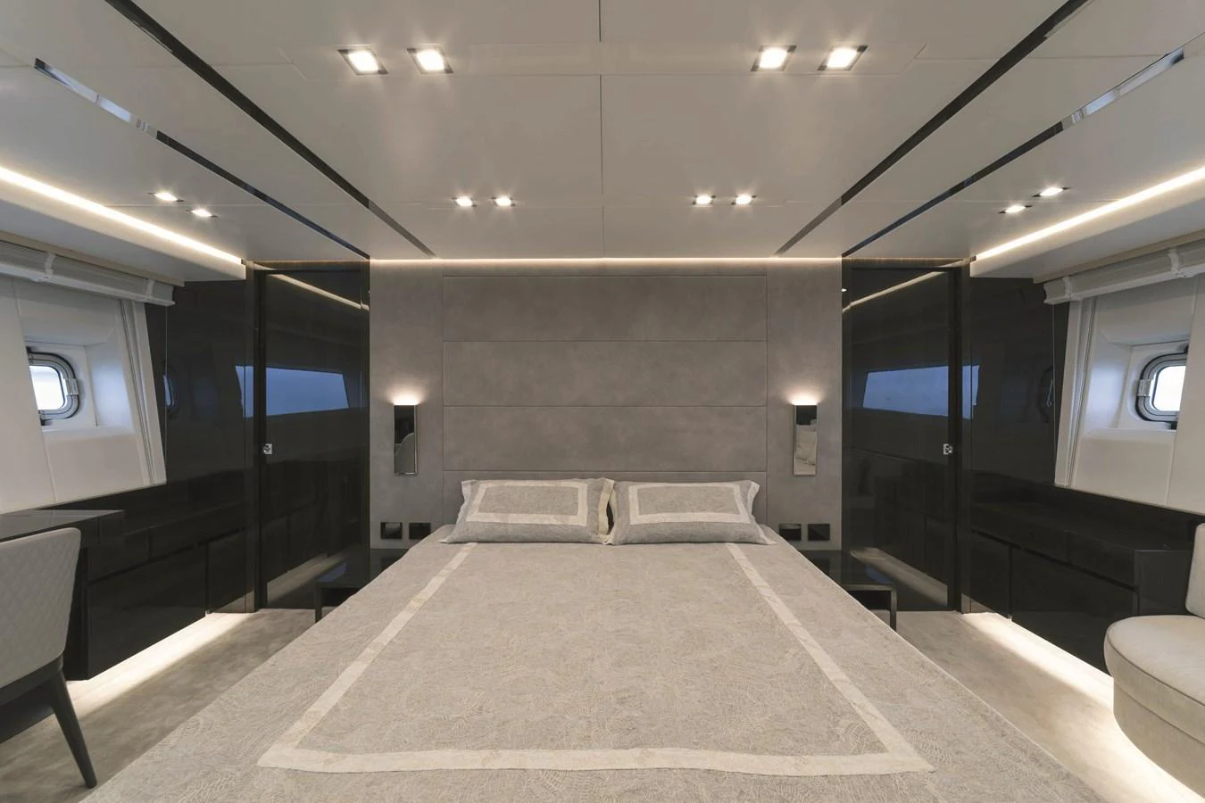 The master stateroom features a luxurious bed with modern lighting and sleek design elements. aboard AB 80 Yacht for Sale