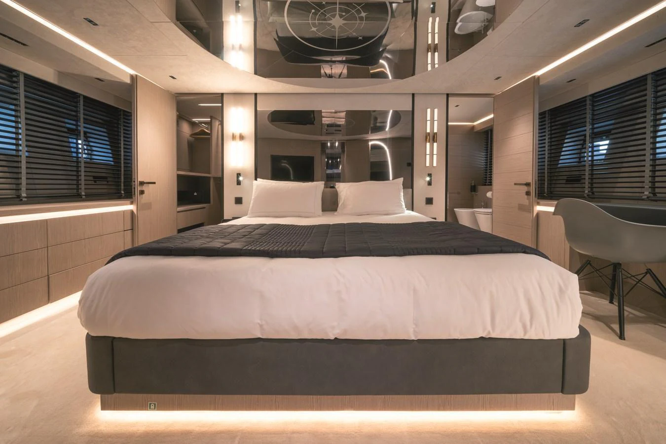 The master stateroom features a luxurious bed with modern decor and ambient lighting. aboard AB 80 Yacht for Sale