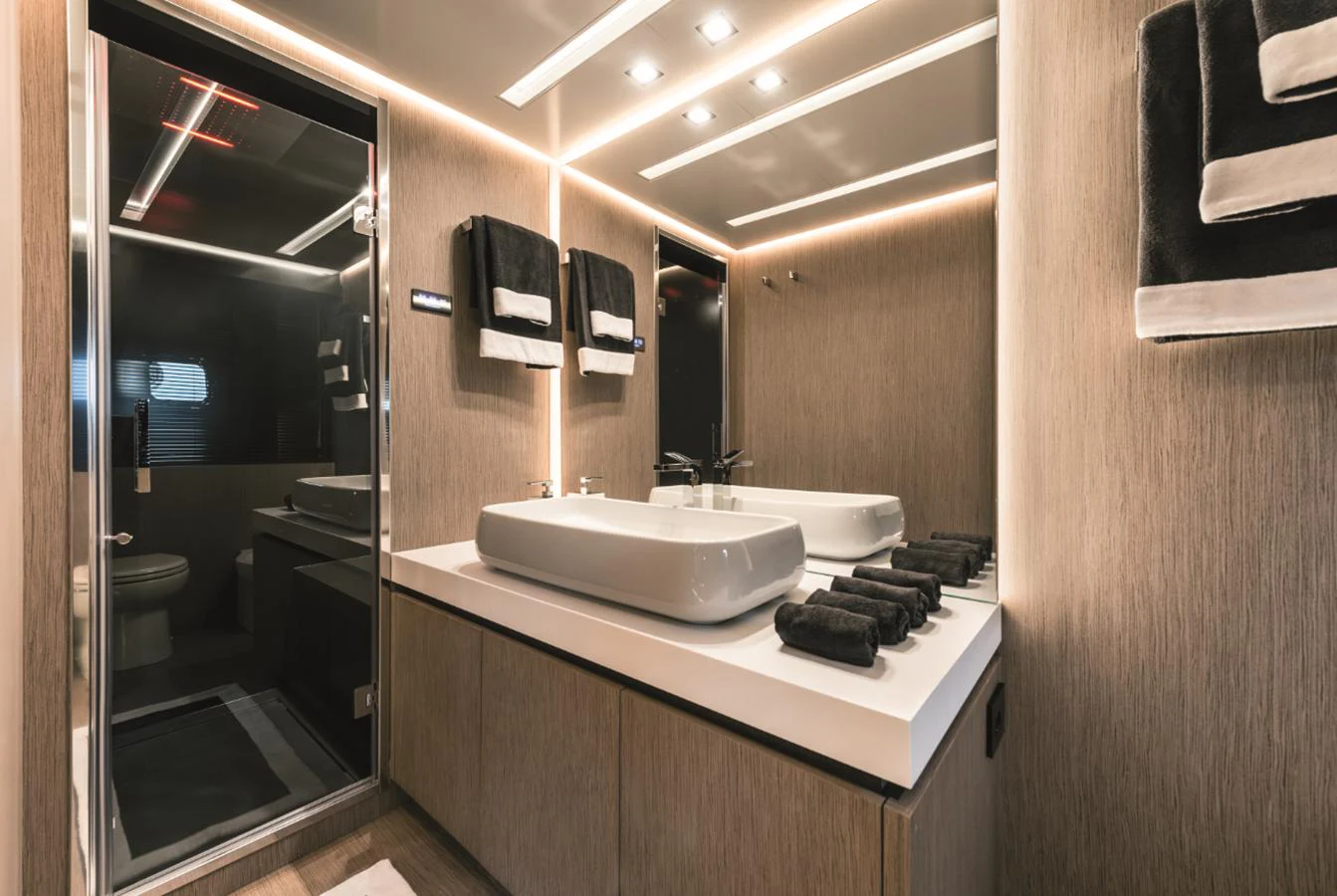 The yacht's bathroom features modern fixtures and elegant lighting. aboard AB 80 Yacht for Sale
