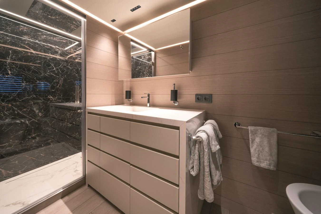 A luxurious yacht bathroom featuring modern fixtures and elegant design. aboard AB 80 Yacht for Sale