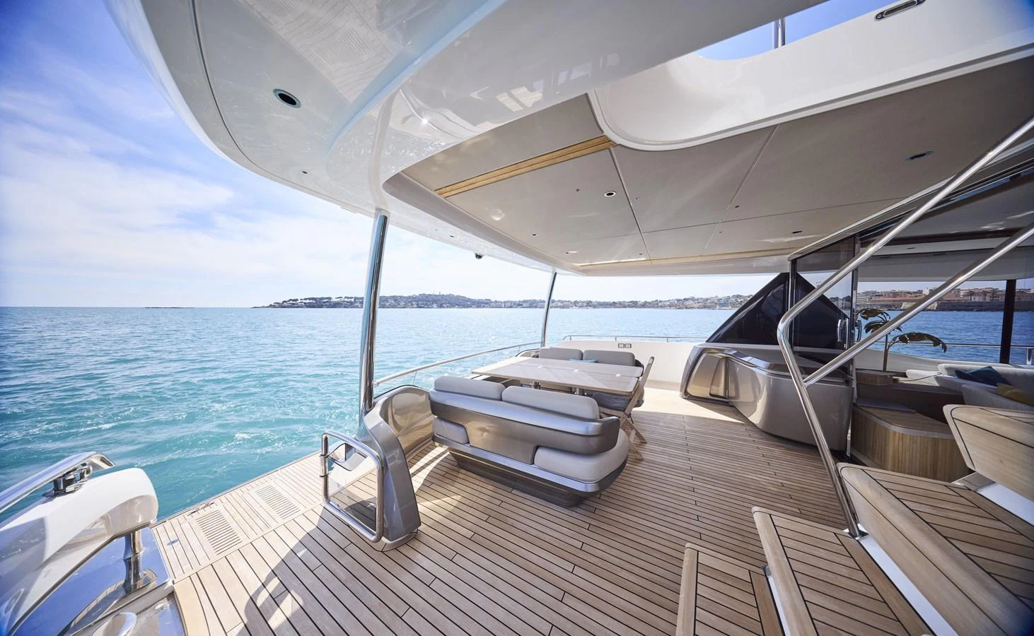 The spacious aft deck offers a luxurious outdoor lounging area with stunning ocean views. aboard POLARIS Yacht for Sale