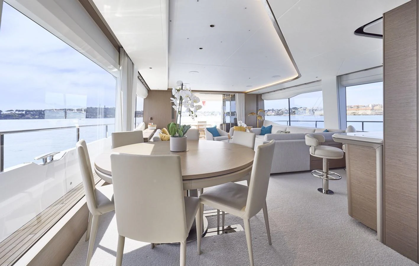 The salon features a spacious and modern design with panoramic windows offering stunning views. aboard POLARIS Yacht for Sale