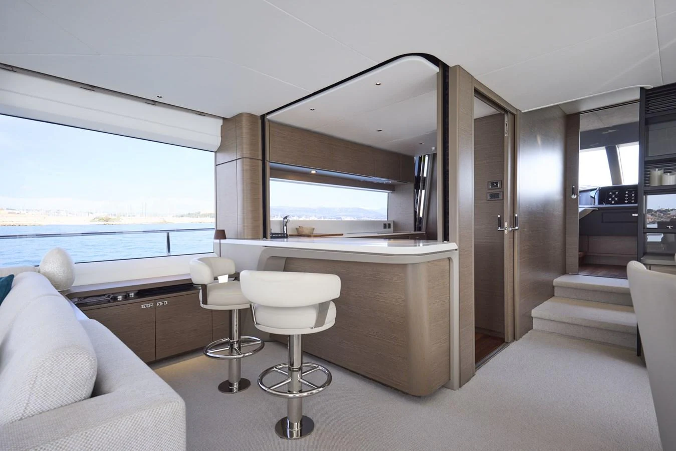 The yacht's galley features modern design with sleek cabinetry and comfortable seating, offering a luxurious space for dining and relaxation. aboard POLARIS Yacht for Sale