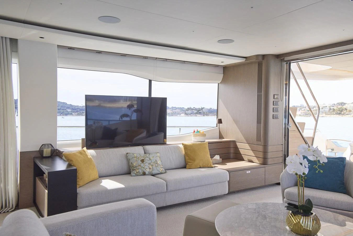 The salon offers a spacious and elegant seating area with large windows providing stunning views. aboard POLARIS Yacht for Sale