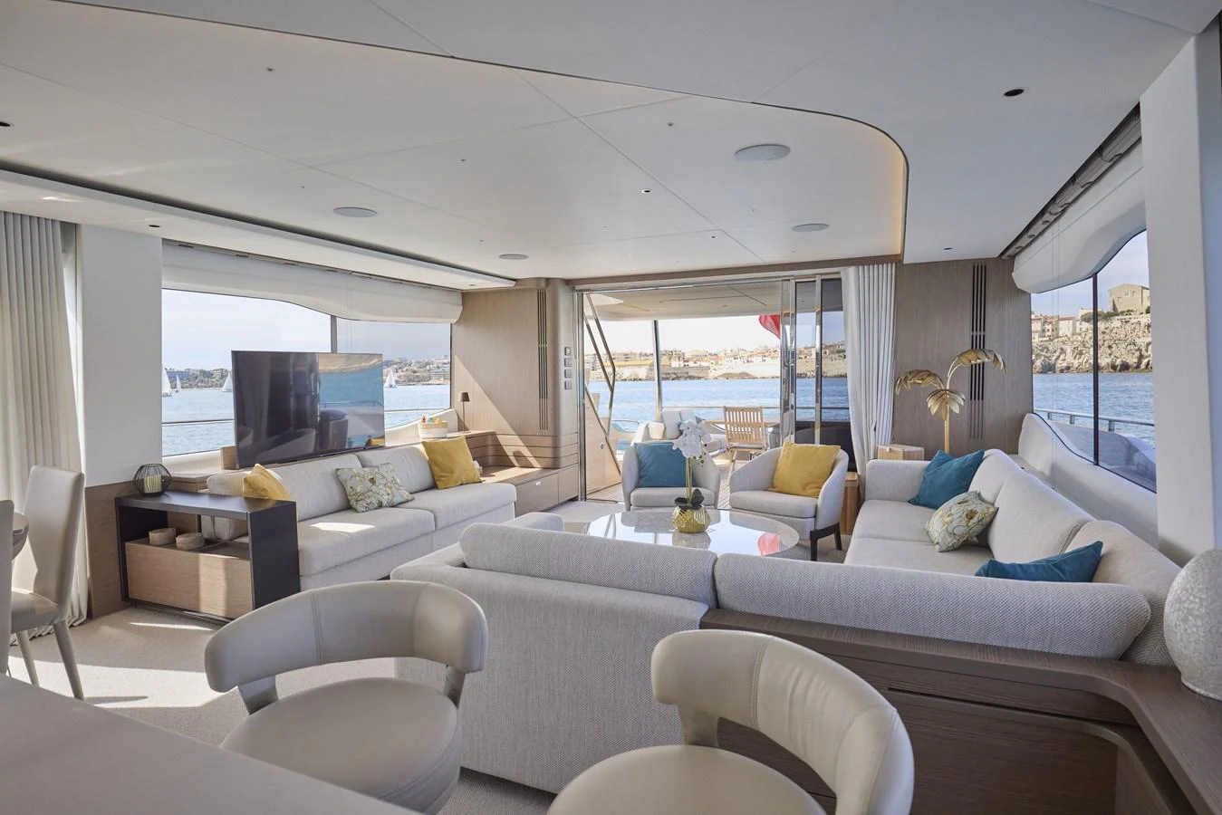 The spacious salon features elegant seating with panoramic views through large windows. aboard POLARIS Yacht for Sale