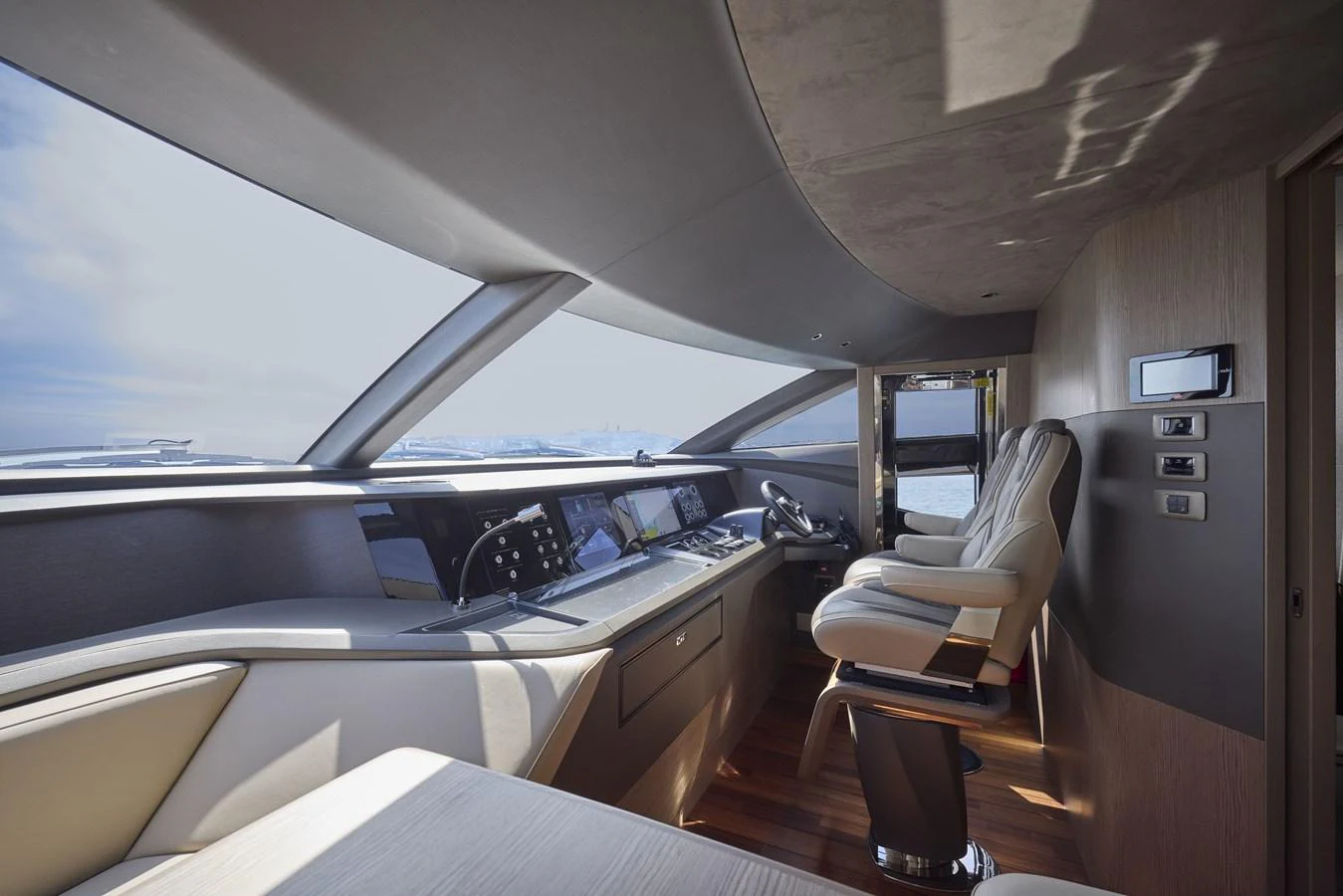 The helm station features modern controls and luxurious seating with panoramic views. aboard POLARIS Yacht for Sale