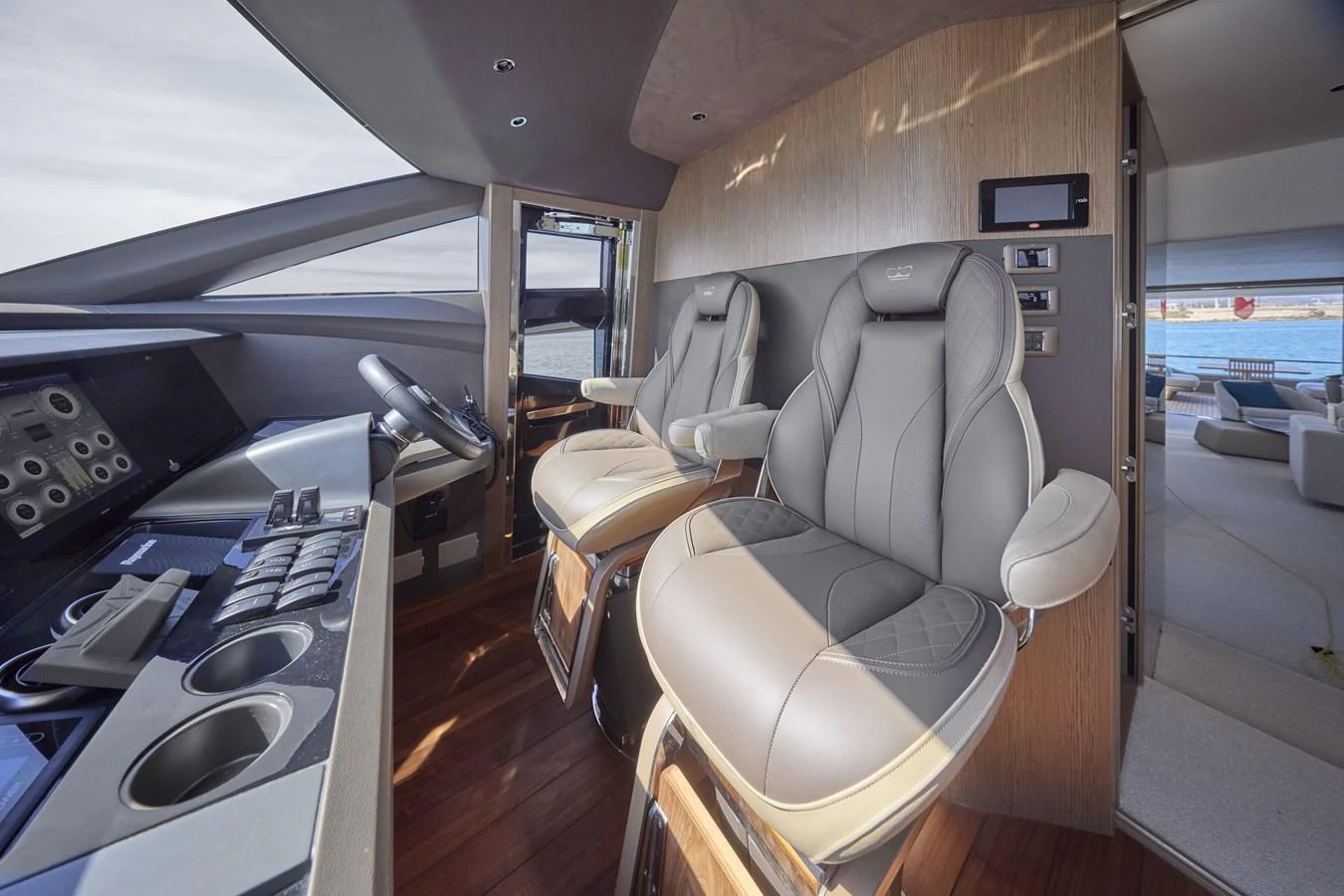 The helm station features luxurious seating and state-of-the-art controls, offering a commanding view for navigation. aboard POLARIS Yacht for Sale