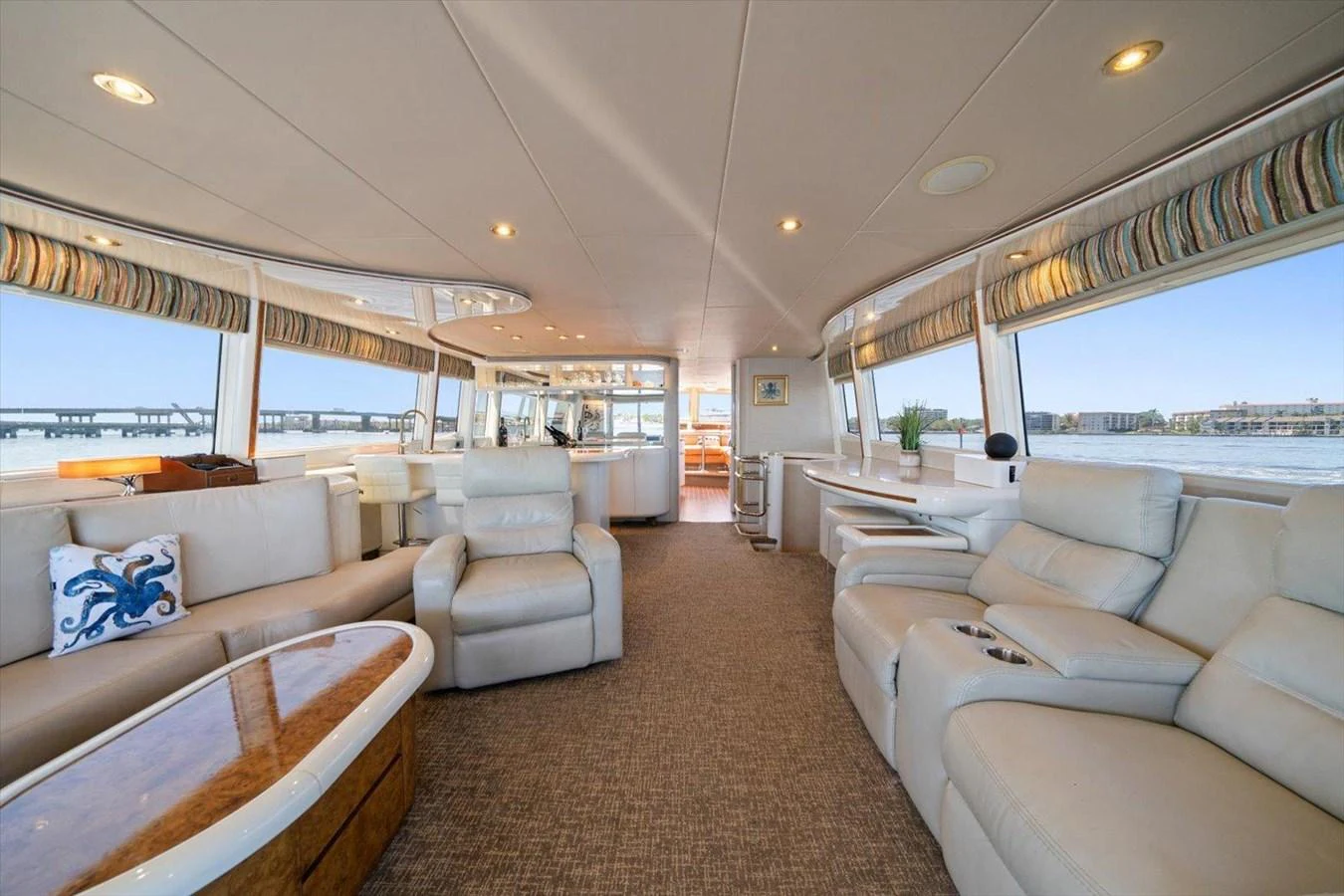 The spacious salon features luxurious seating with panoramic views. aboard OCTOPI Yacht for Sale