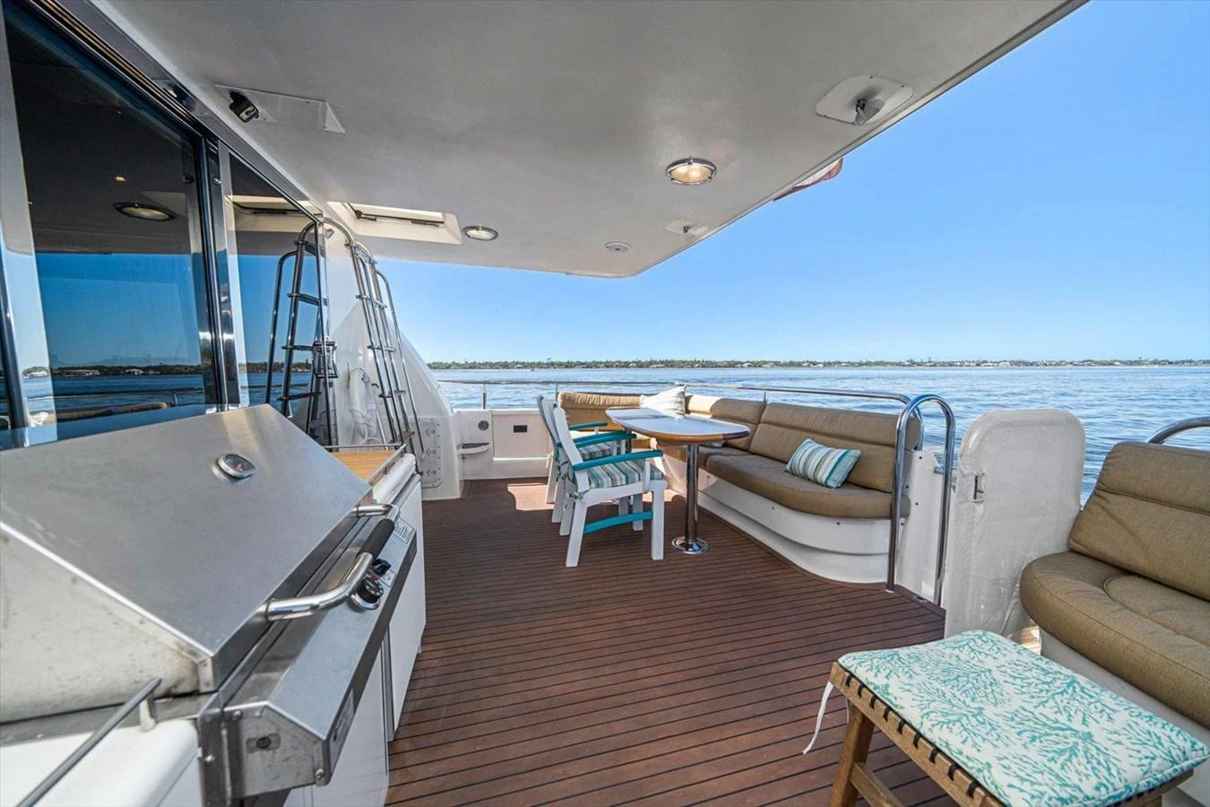 The aft deck offers a spacious and inviting area for outdoor dining and relaxation with stunning water views. aboard OCTOPI Yacht for Sale