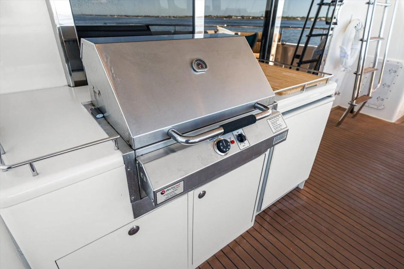 The yacht features a sleek stainless steel grill area, perfect for outdoor cooking and entertaining. aboard OCTOPI Yacht for Sale