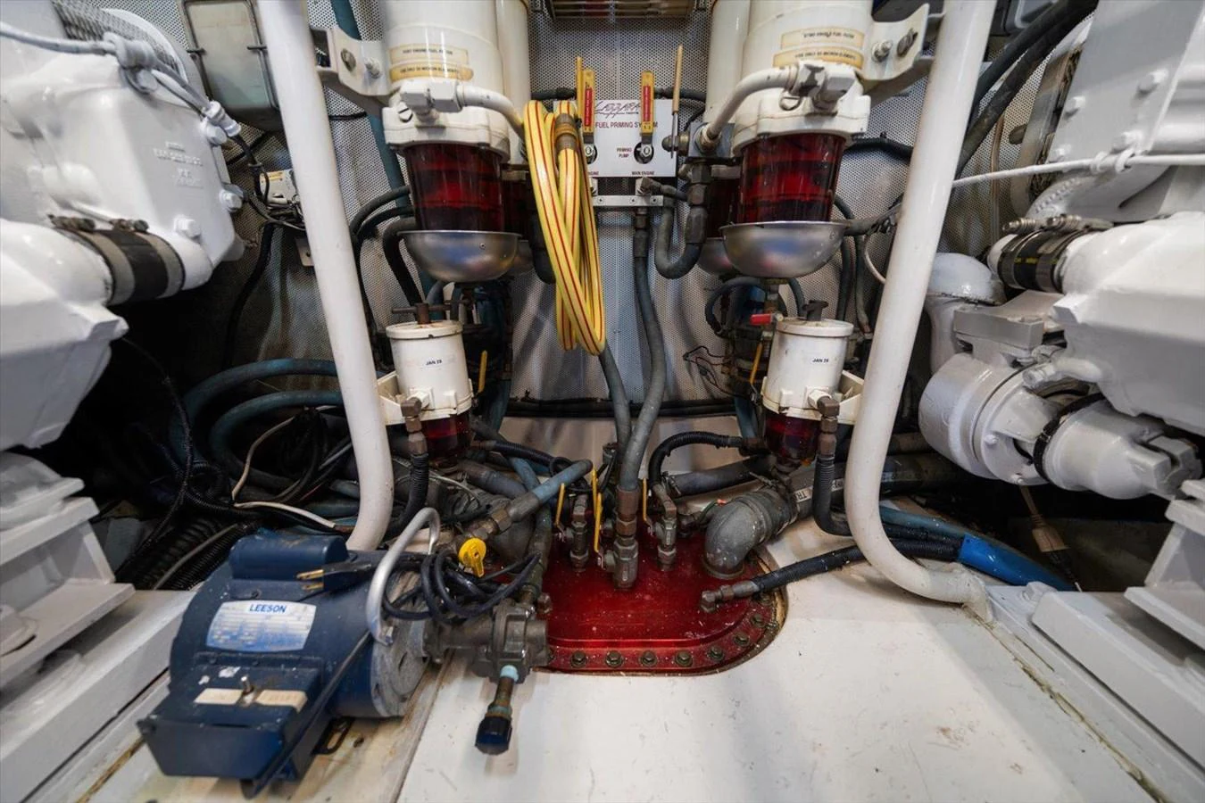 The image showcases the yacht's well-maintained engine room with various mechanical components and systems. aboard OCTOPI Yacht for Sale