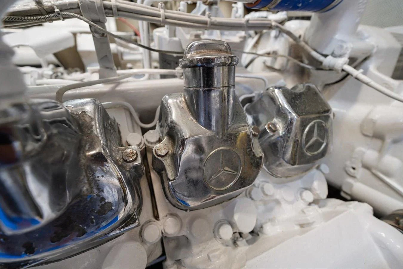 A close-up view of the yacht's engine components, showcasing polished metal parts. aboard OCTOPI Yacht for Sale