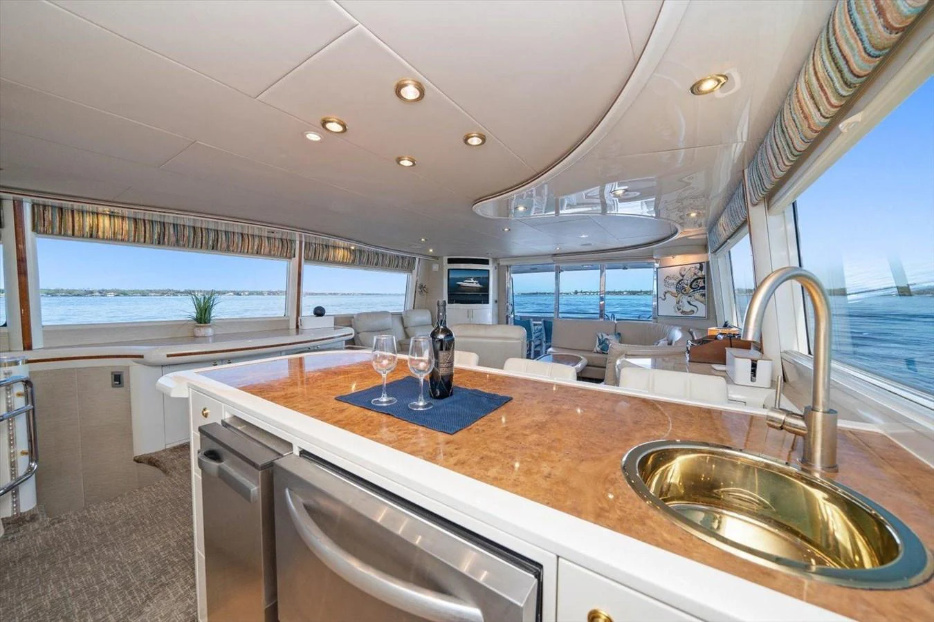 The yacht's salon features a spacious and elegant design with ample seating and a well-equipped kitchenette. aboard OCTOPI Yacht for Sale
