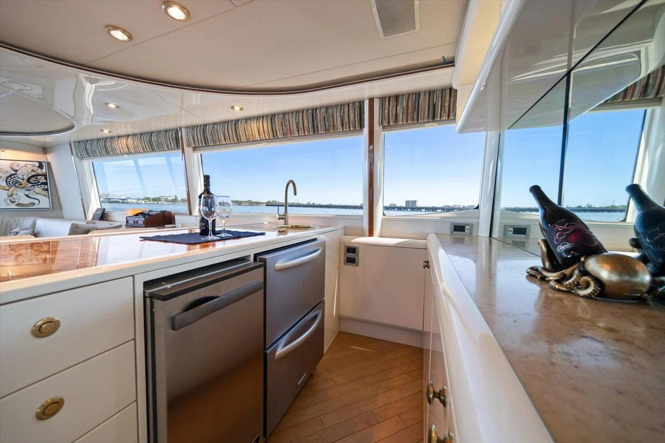 The yacht's galley features modern appliances and ample counter space with a view of the water. aboard OCTOPI Yacht for Sale