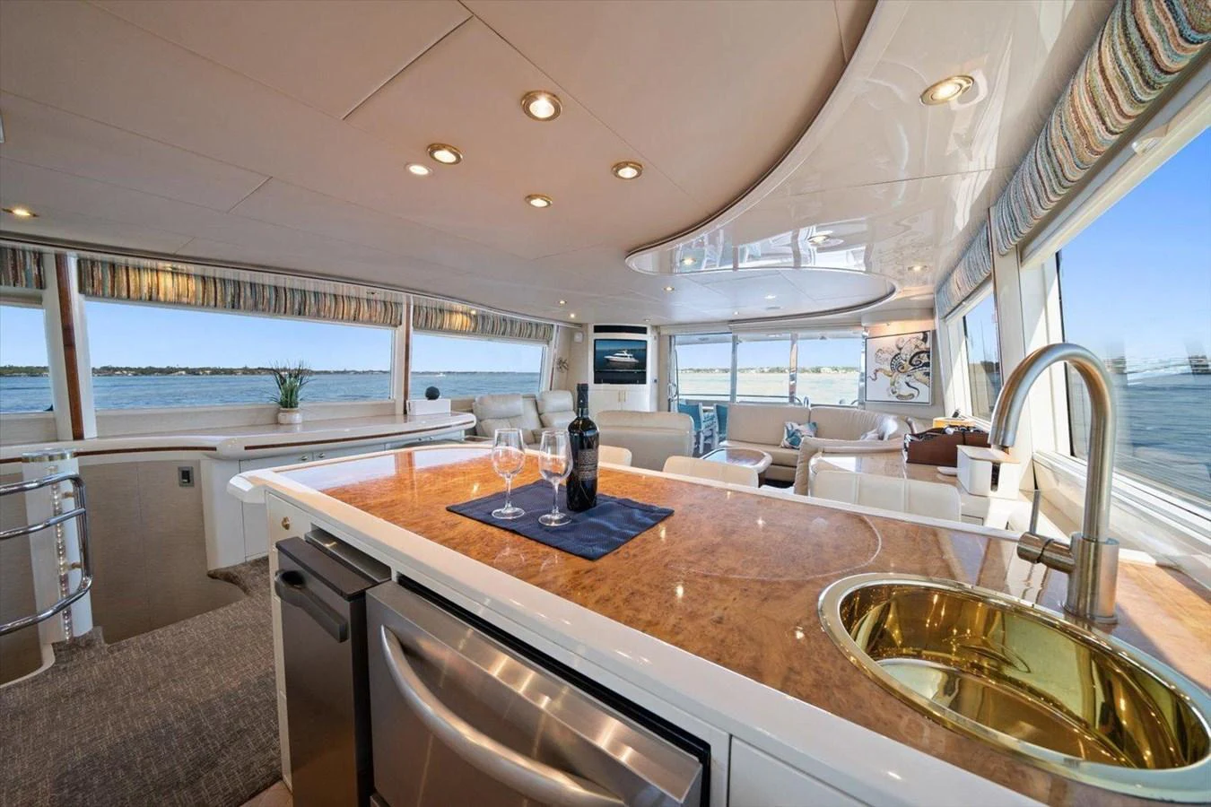 The yacht's galley features a luxurious and spacious design with panoramic windows offering stunning sea views. aboard OCTOPI Yacht for Sale