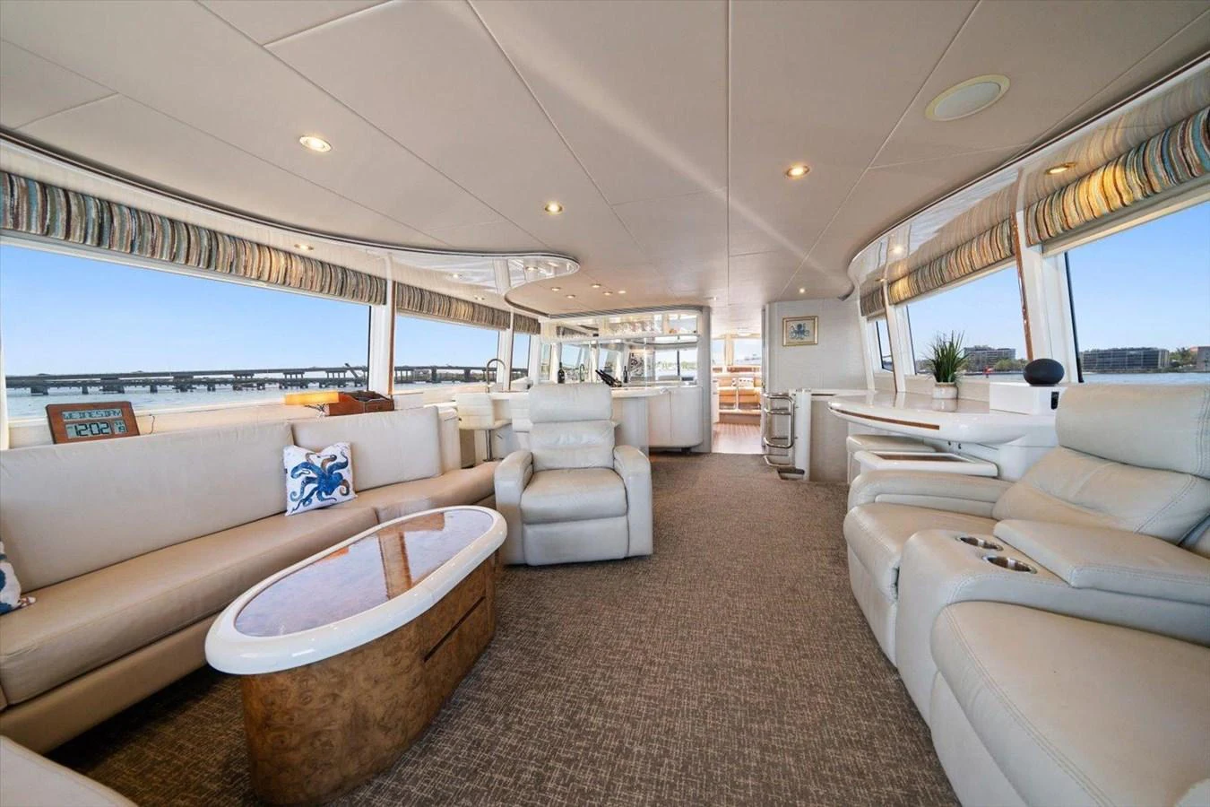 The spacious salon features comfortable seating and panoramic windows for a luxurious experience. aboard OCTOPI Yacht for Sale