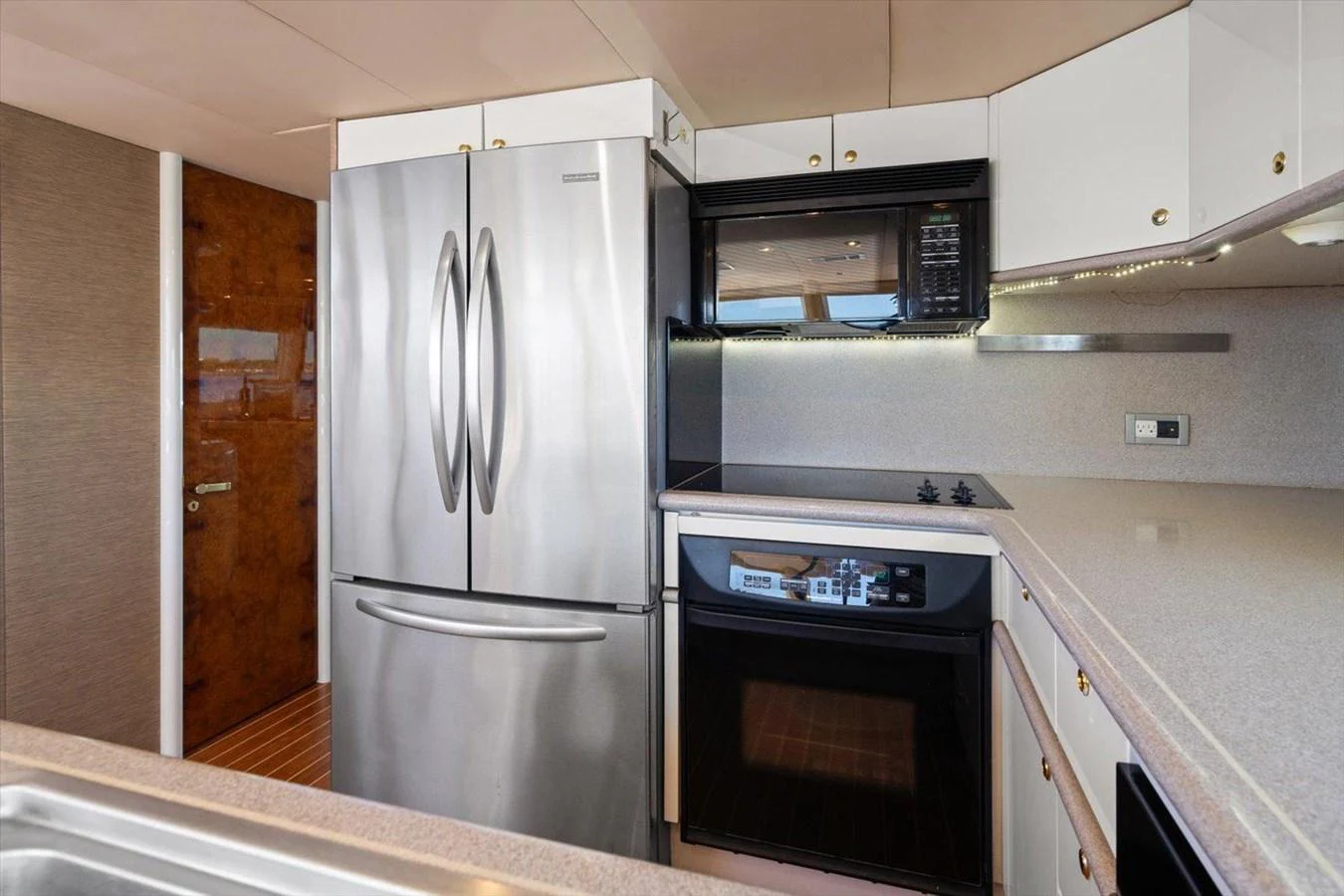 The yacht's galley features modern stainless steel appliances and ample counter space. aboard OCTOPI Yacht for Sale