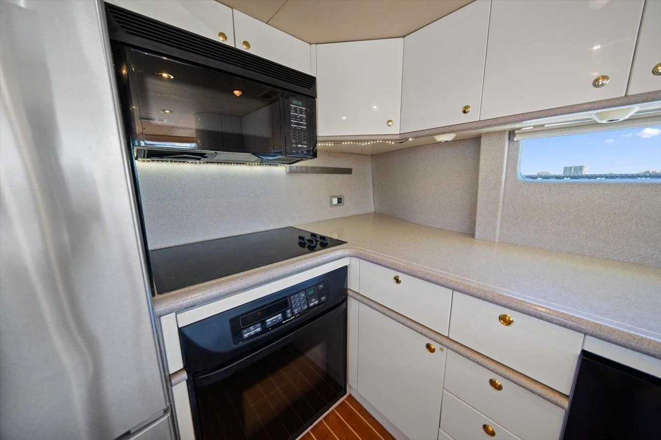 The galley features modern appliances and ample counter space, perfect for onboard culinary adventures. aboard OCTOPI Yacht for Sale