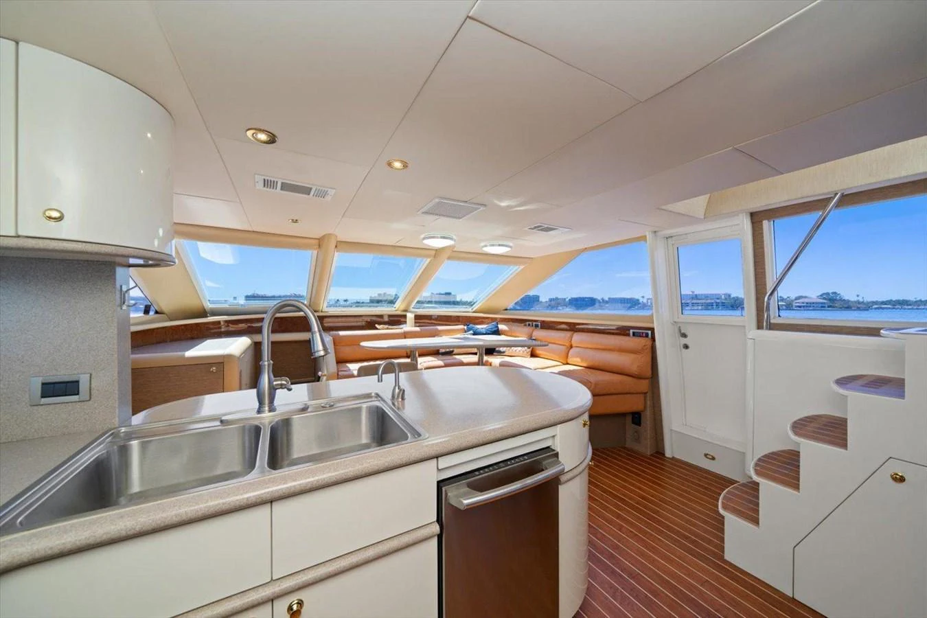 The yacht's galley features modern appliances and a cozy dining area with panoramic windows. aboard OCTOPI Yacht for Sale