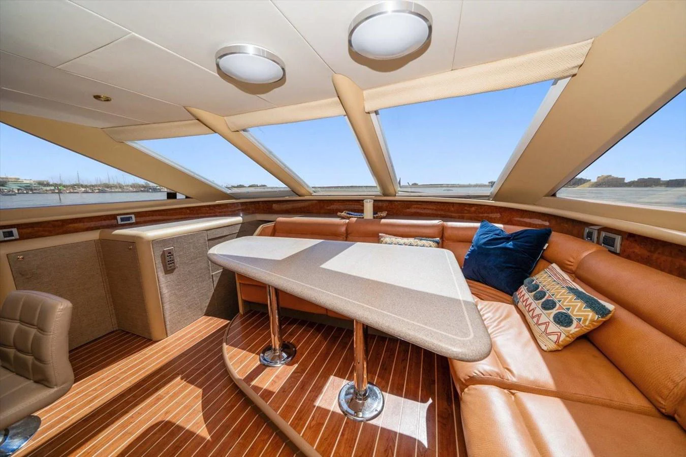 The salon features a spacious seating area with large windows providing ample natural light. aboard OCTOPI Yacht for Sale