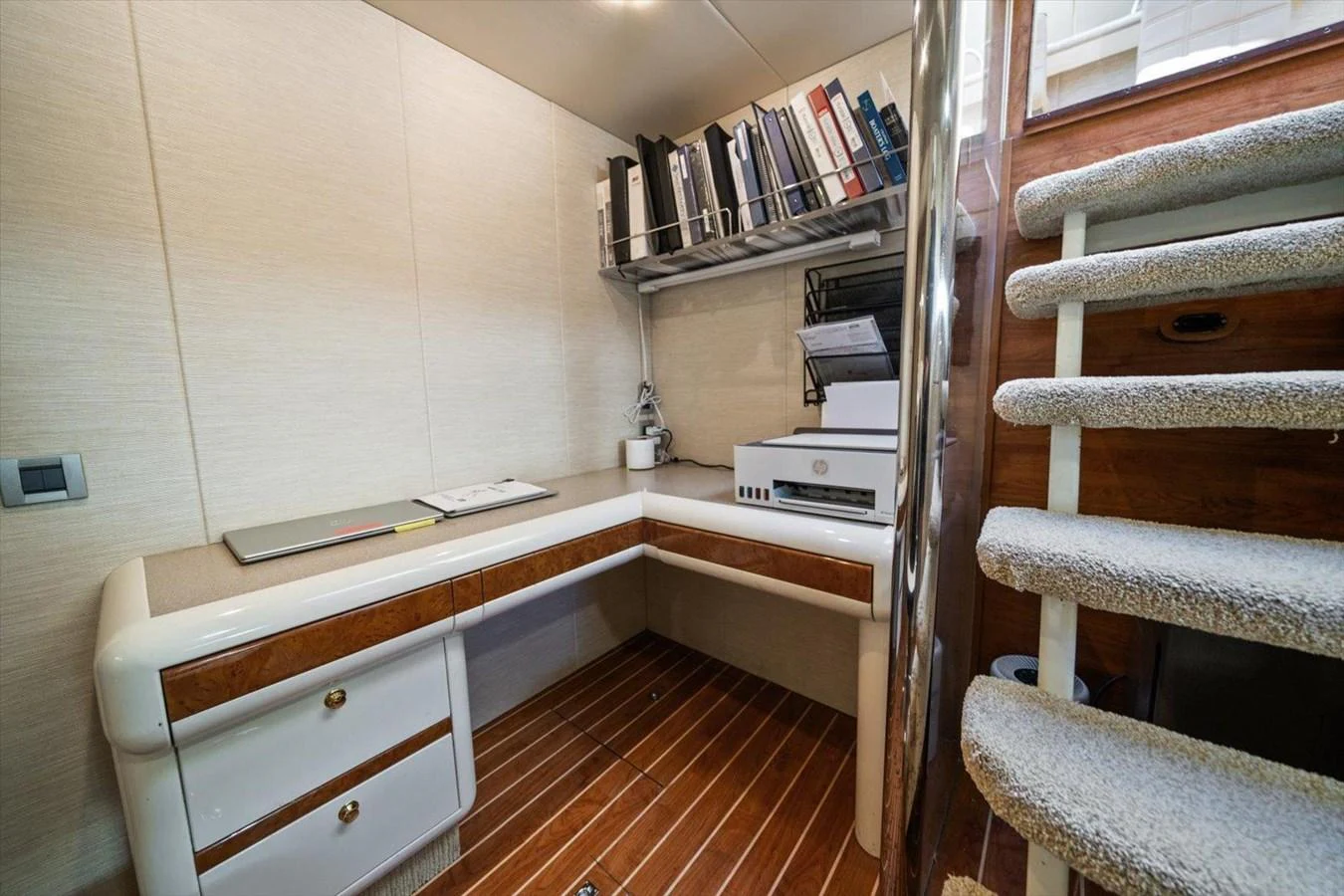 The yacht features a well-appointed office space with a built-in desk and ample storage. aboard OCTOPI Yacht for Sale
