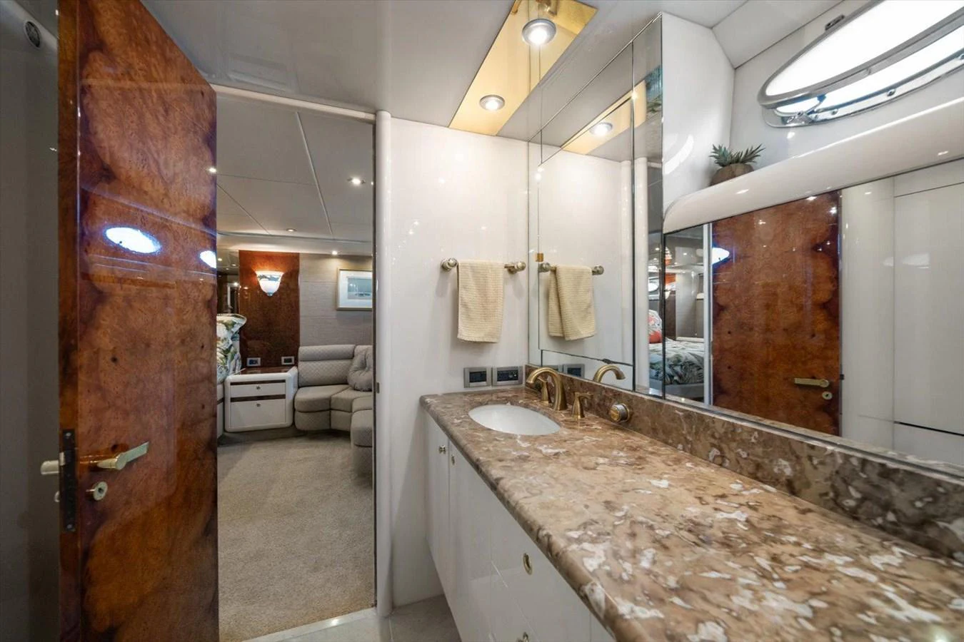 The yacht's bathroom features a luxurious marble countertop and elegant fixtures. aboard OCTOPI Yacht for Sale