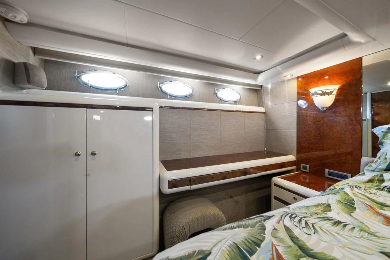 The stateroom features elegant wood finishes and modern lighting, creating a cozy and inviting atmosphere. aboard OCTOPI Yacht for Sale