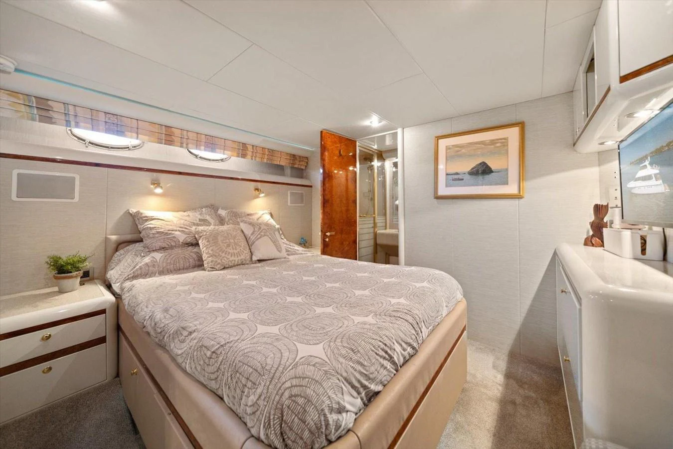A cozy stateroom featuring a comfortable bed and elegant decor. aboard OCTOPI Yacht for Sale