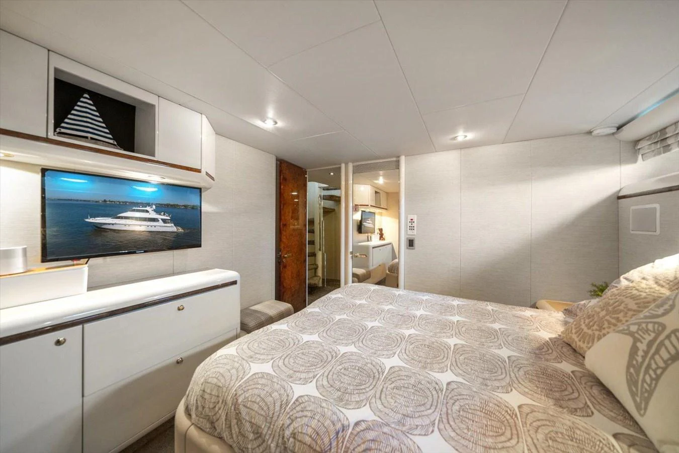 The stateroom offers a cozy and elegant retreat with a comfortable bed and modern amenities. aboard OCTOPI Yacht for Sale